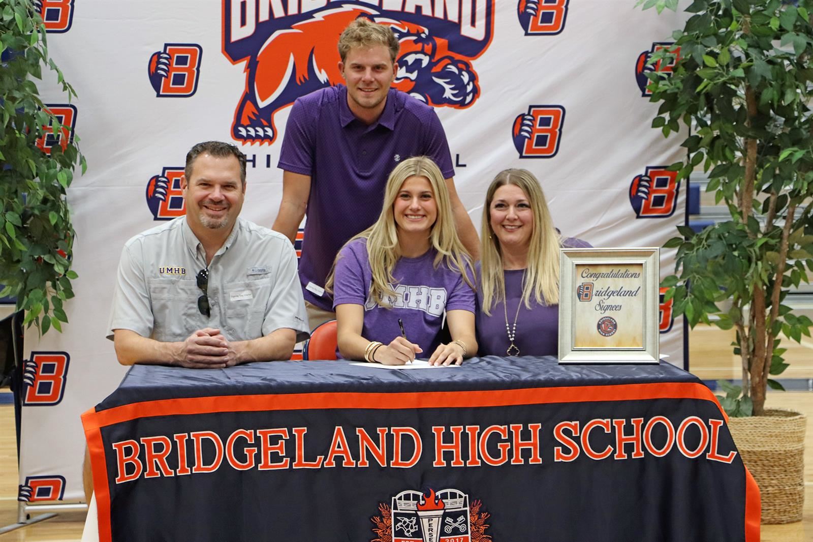 Bridgeland High School senior Raylee Schaffner, seated center, signed her letter of intent to play volleyball.